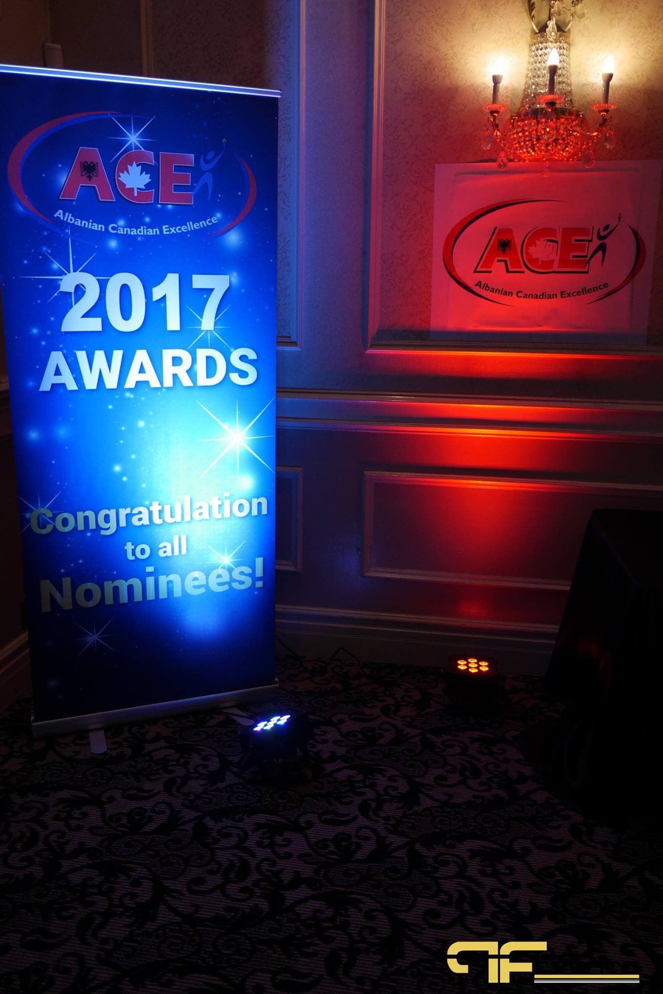 ACE 2017 Awards pull-up banner beside red uplighting and floor LED pars