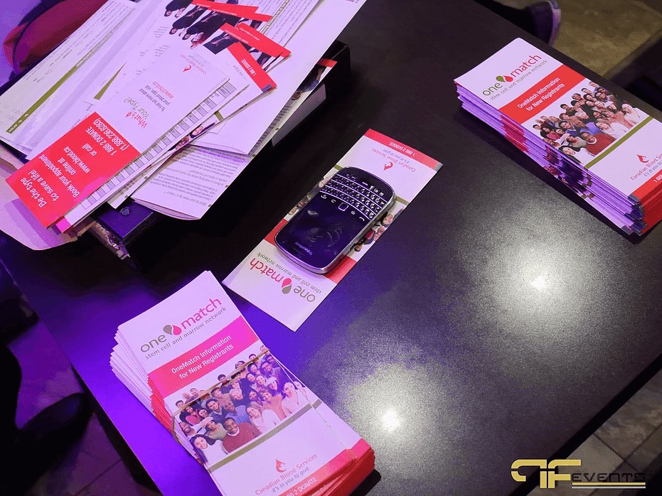 OneMatch brochures and registration forms on a restaurant table