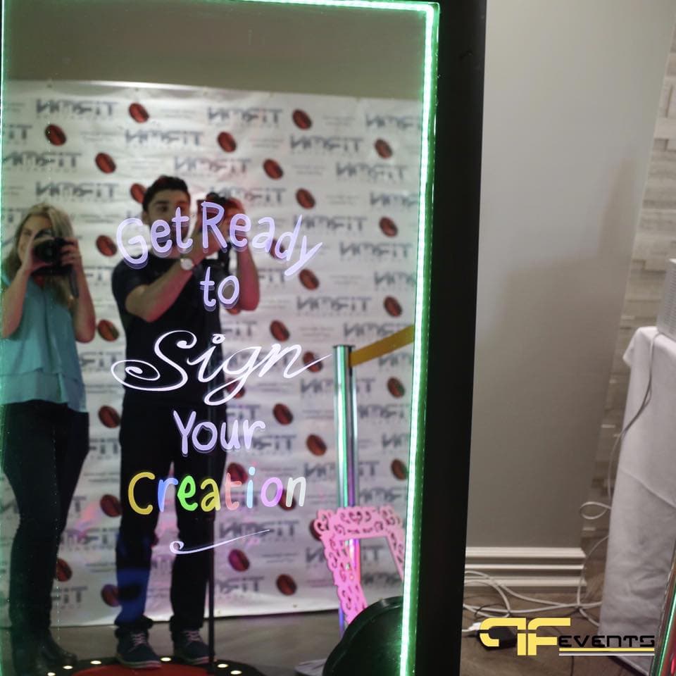 Magic-mirror photo booth screen reading “Get Ready to Sign Your Creation”