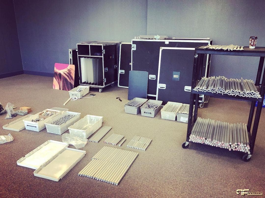 Road cases and aluminium frame kit unpacked for a décor build