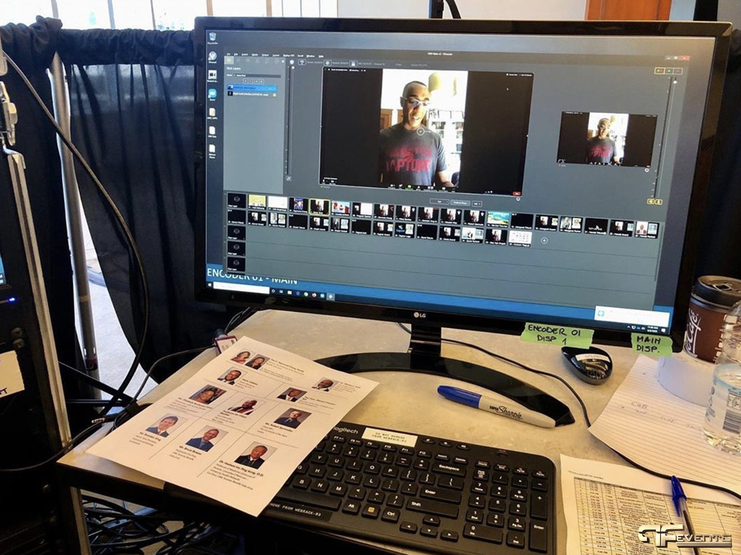 Encoder 01 main monitor showing a remote speaker, headshot sheet on the desk