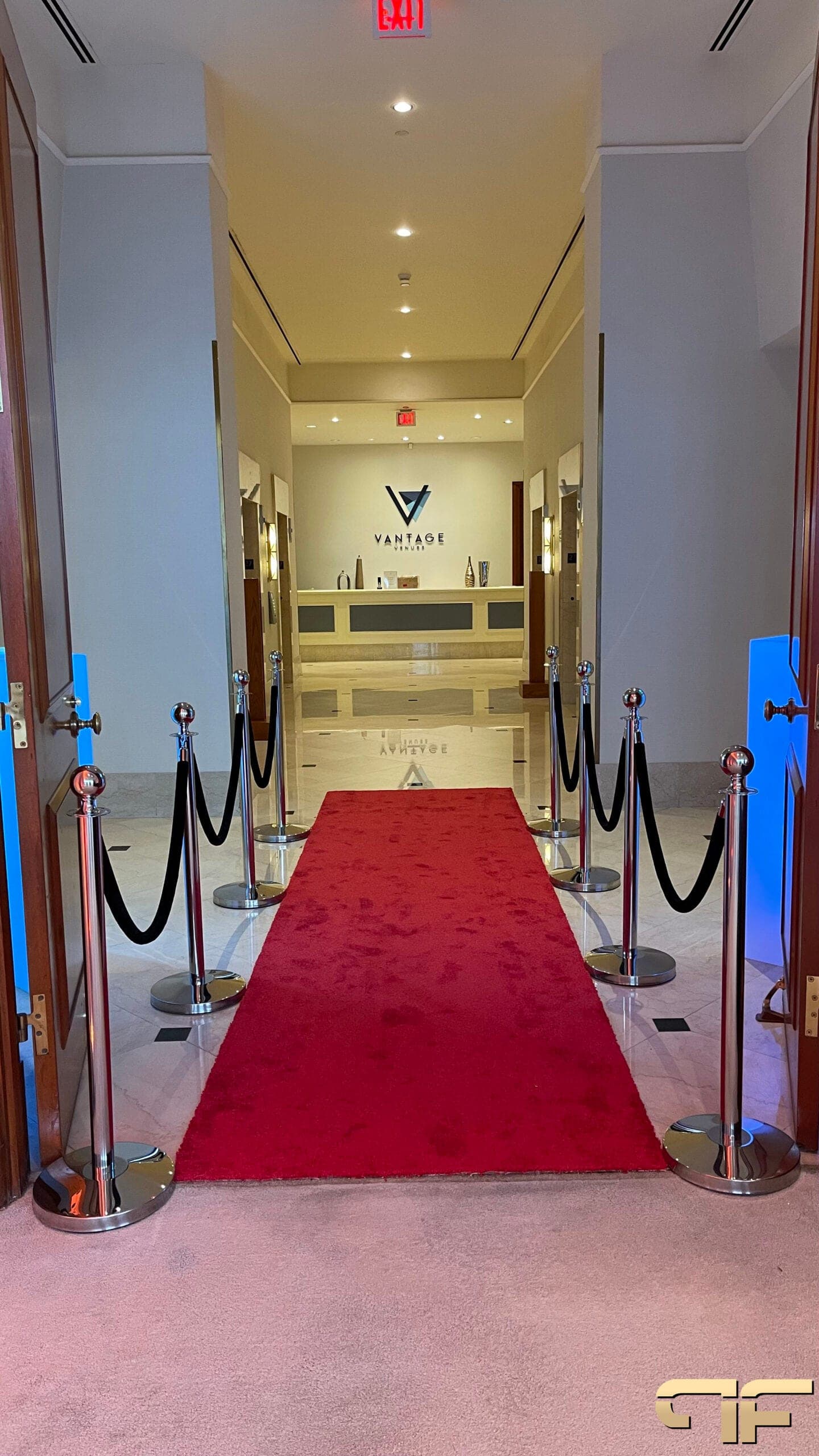 Red carpet and velvet ropes running down the corridor to the Vantage Venues reception desk